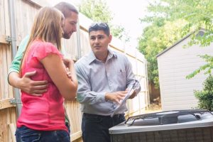 HVAC technician answering a homeowner's questions
